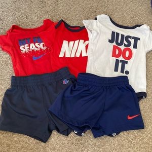 Bundle of baby onesies with shorts. Nike/ champion